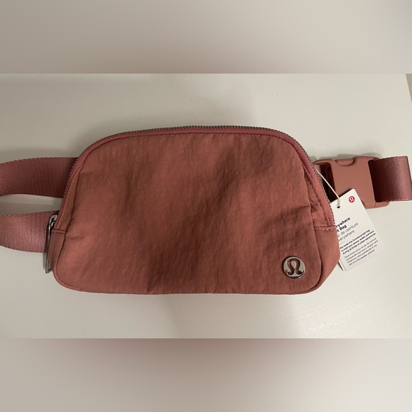 lululemon belt bag deco pink Everywhere Crossbody 1L Interior pockets hold the essentials Lululemon's 'We Made Too Much'